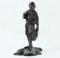 Antique Japanese Meiji Period Bronze of an Old Man Carrying a Basket