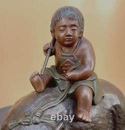 Beau bronze japonais de l'époque Meiji Okimono Kintaro garçon sur un ours