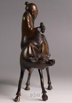 Brûleur d'encens en bronze japonais antique : un dieu chevauchant une vache, ère Meiji du XIXe siècle